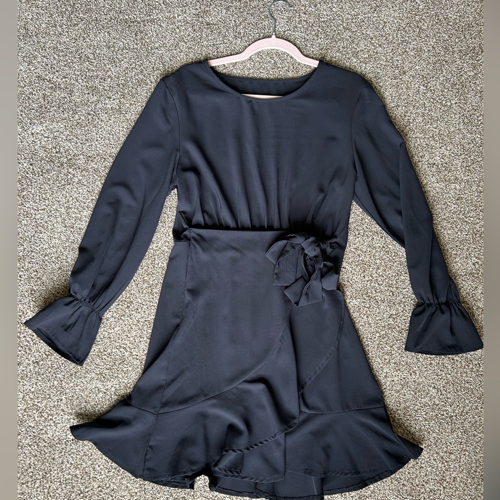 Little black dress with faux wrap and ruffle hem